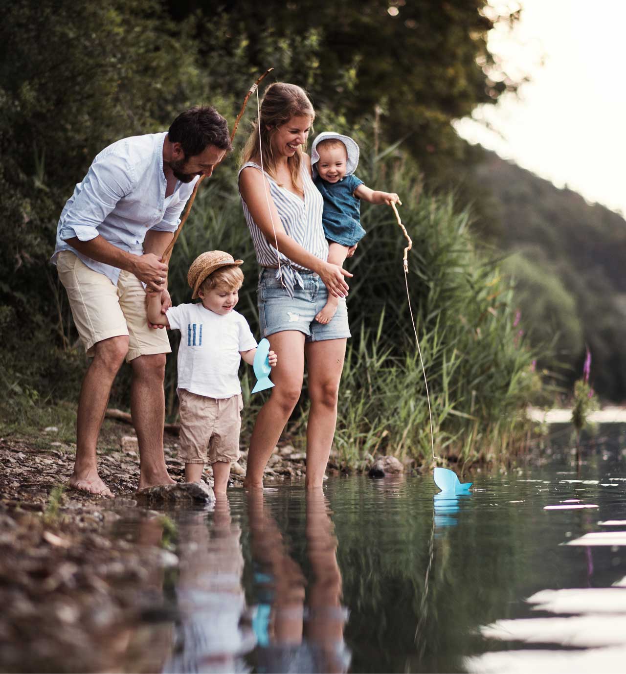 family-by-lake family fishing by the lake